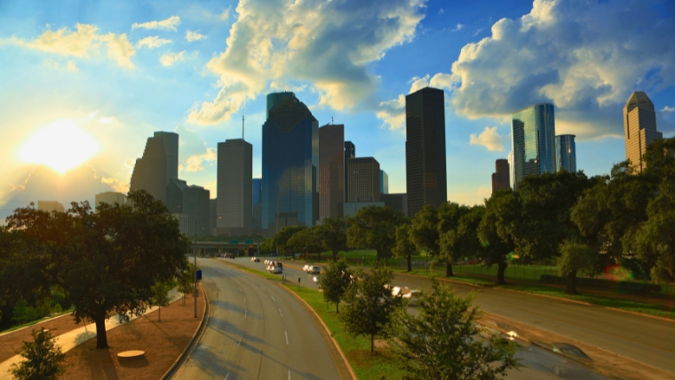 The Top Mental Health Professionals and Psychiatry Services in Houston A view of the Houston skyline with the sun peaking through the clouds | The Top Mental Health Professionals and Psychiatry Services in Houston | Mindful Health Solutions