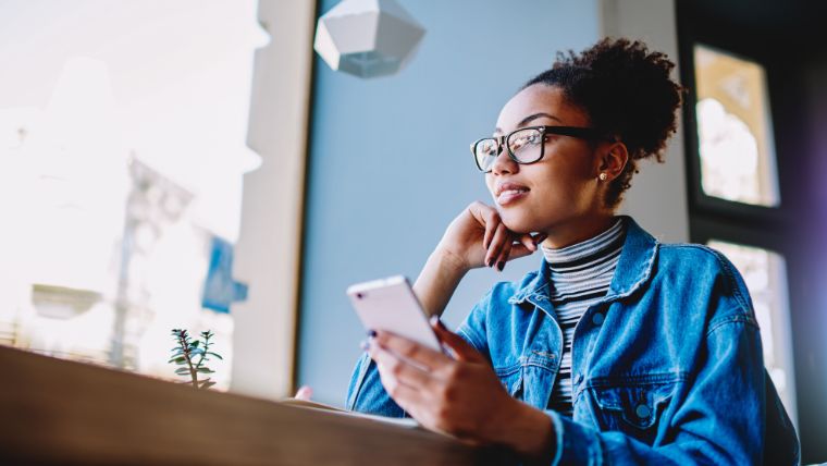 How-To-Select-the-Right-Mental-Health-Care-Provider Woman thinking and doing research on her phone | Finding a Therapist or Psychiatrist: How to Make the Best Decision for Your Mental Health