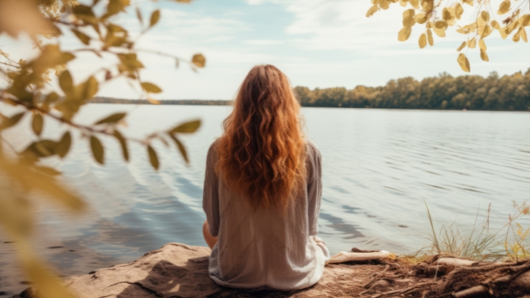 How To Set and Maintain Healthy Boundaries for Your Emotional Well-Being Woman sitting facing a lake | How To Set and Maintain Healthy Boundaries for Your Emotional Well-Being