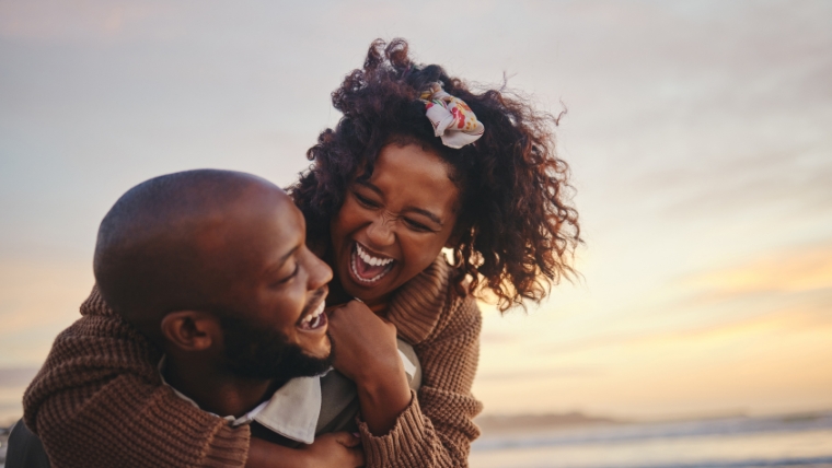 5-Boundaries-To-Set-in-Your-Relationship-that-Benefit-Everyones-Mental-Health Couple laughing on the beach | 5 Boundaries To Set in Your Relationship that Benefit Everyone's Mental Health | Mindful Heatlh Solutions
