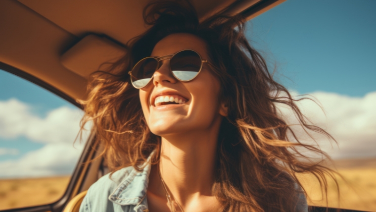 No-More-Stress-Why-Boundaries-Are-Your-New-Anxiety-Busting-Tool Caucasian woman in a car with sunglasses on, smiling with sun on face and hair in wind | No More Stress Why Boundaries Are Your New Anxiety-Busting Tool | Mindful Health Solutions