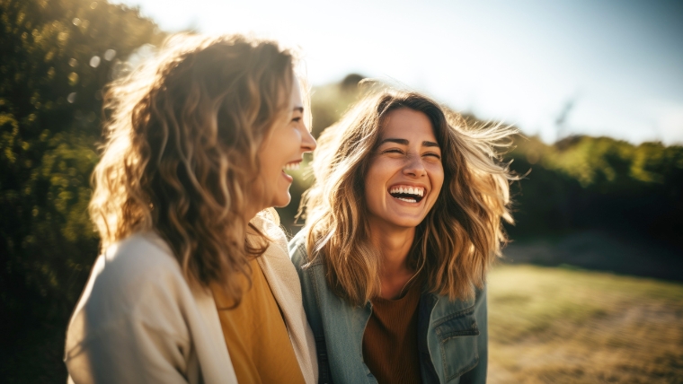 Feel-Better-in-Just-2-Weeks-Accelerated-TMS-for-Major-Depression Two women laughing together outside | Feel Better in Just 2 Weeks Accelerated TMS for Major Depression | Mindful Health Solutions