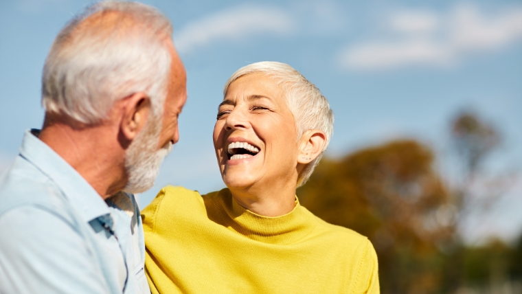 How-TMS-Therapy-is-Transforming-Fibromyalgia-Treatment-for-Good Mature couple outside happy and laughing | How TMS Therapy is Transforming Fibromyalgia Treatment for Good | Mindful Health Solutions