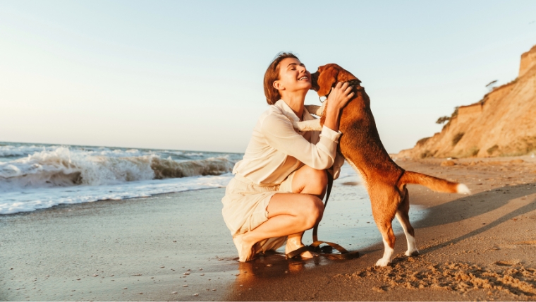 Cultivate-Happiness-How-to-Unlock-the-Power-of-Mindful-Appreciation A woman on the beach with her dog | Cultivate Happiness: How to Unlock the Power of Mindful Appreciation | Mindful Health Solutions