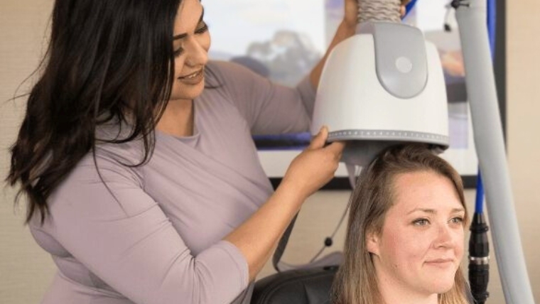 It’s Not Brain Zapping Debunking the 5 Myths of TMS Therapy Woman providing TMS therapy treatment to a patient | It's Not Brain Zapping Debunking the 5 Myths of TMS Therapy | Mindful Health Solutions
