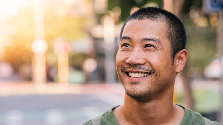 SPRAVATO-Safety-Separating-Fact-from-Fiction-for-Informed-Decisions A smiling man on a city street | SPRAVATO Safety: Separating Fact from Fiction for Informed Decisions | Mindful Health Solutions