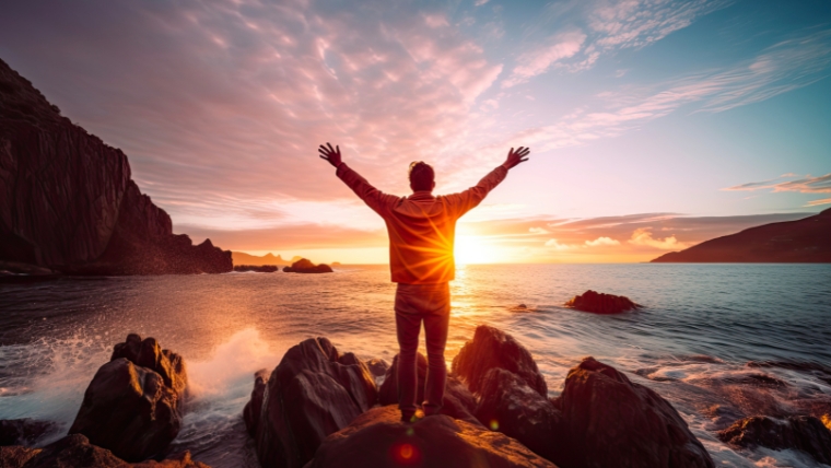 8 Ways Ketamine Infusion Therapy Can Transform Your Anxiety Man with Arms Outstretched at Mountainous Coastline | 8 Ways Ketamine Infusion Therapy Can Transform Your Anxiety | Mindful Health Solutions