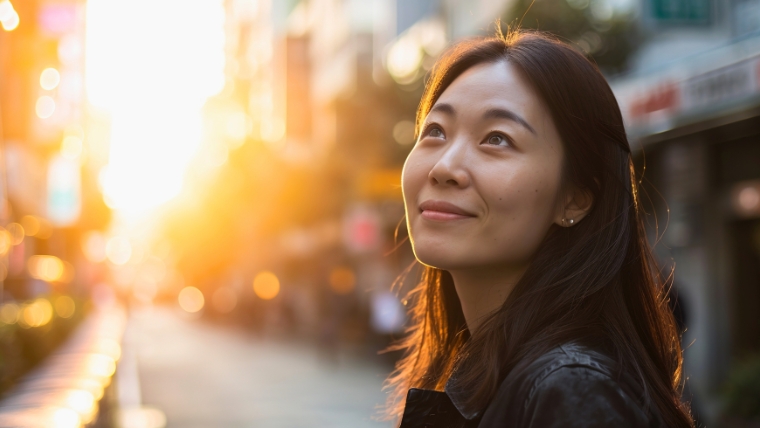 Navigating Spravato Therapy Setbacks Maintaining Hope and Your Next Steps A woman looking hopeful on a city street while the sun sets | Navigating Spravato Therapy Setbacks Maintaining Hope and Your Next Steps | Mindful Health Solutions