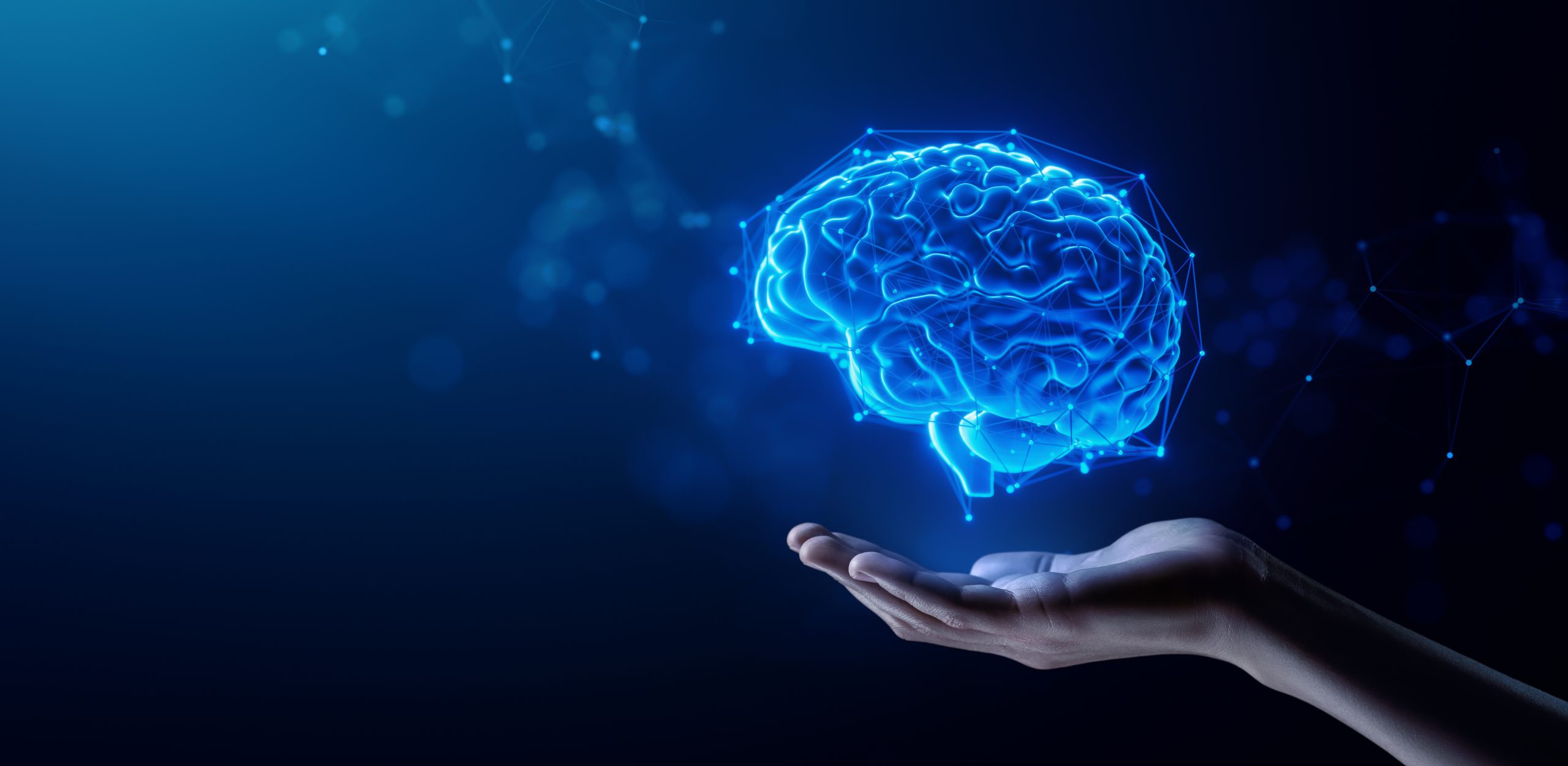 Hand Holding Human Brain – Futuristic Concept of Intelligence, science and mind Hand Holding Human Brain - Futuristic Concept of science and mind for esketamine therapy patients being treated for treatment-resistant depression (TRD) and Major Depressive Disorder (MDD)